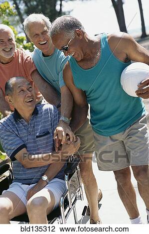 Senior men relaxing outdoors View Large Photo Image Stock Image - Senior men relaxing outdoors. Fotosearch
