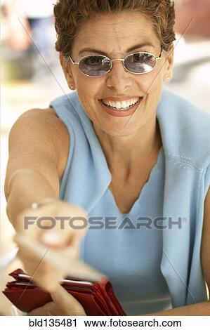 Senior woman paying with credit card View Large Photo Image Stock Image - Senior woman paying with credit card. Fotosearch