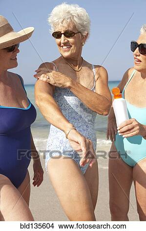 Senior women walking on beach View Large Photo Image Picture - Senior women walking on beach. Fotosearch