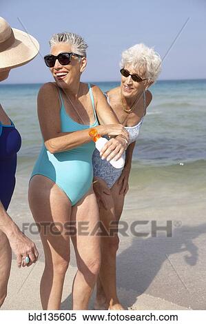 Senior women walking on beach View Large Photo Image Stock Photography - Senior women walking on beach. Fotosearch