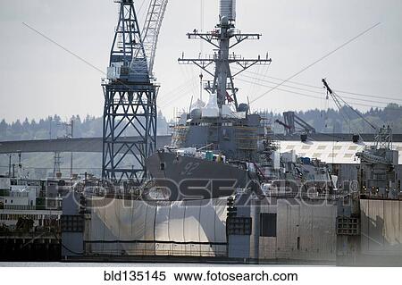 Shipping cranes and ship in industrial harbor View Large Photo Image Stock Photography - Shipping cranes and ship in industrial harbor. Fotosearch