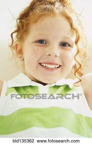 Smiling girl laying on sofa View Large Photo Image Stock Image - Smiling girl laying on sofa. Fotosearch