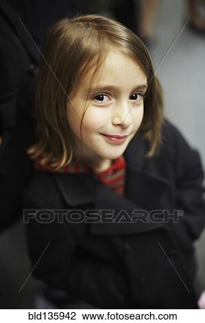 Smiling girl wearing winter coat View Large Photo Image Stock Image - Smiling girl wearing winter coat. Fotosearch