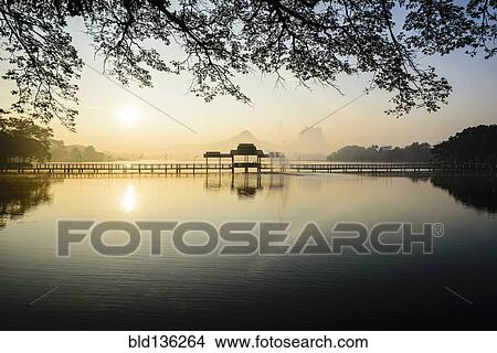 Sunrise over mountains and lake, Hp-Aan, Kayin, Myanmar View Large Photo Image Picture - Sunrise over mountains and lake, Hp-Aan, Kayin, Myanmar. Fotosearch