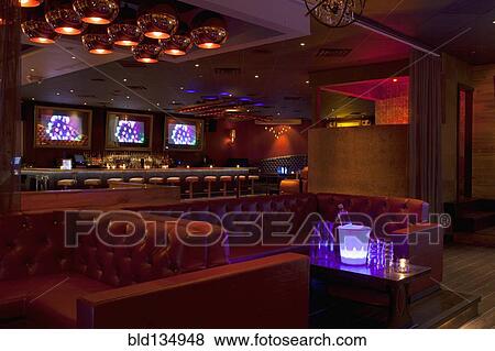 Stock Photo - Tables and booths in empty nightclub. Fotosearch