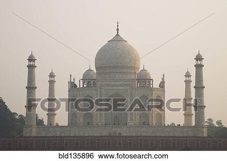 Stock Photograph - Taj Mahal against cloudy sky, Agra, India. Fotosearch