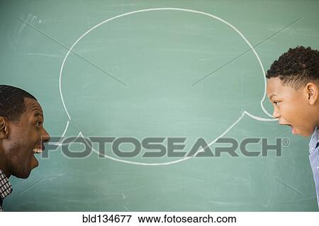 Stock Photo - Teacher and student talking by empty speech bubble. Fotosearch