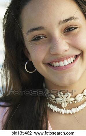 Stock Image - Teenage girl smiling. Fotosearch