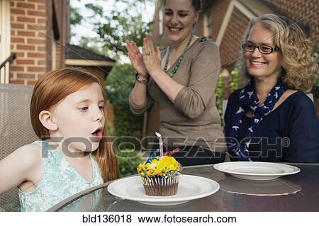 Three generations of Caucasian women celebrating birthday View Large Photo Image Stock Photo - Three generations of Caucasian women celebrating birthday. Fotosearch