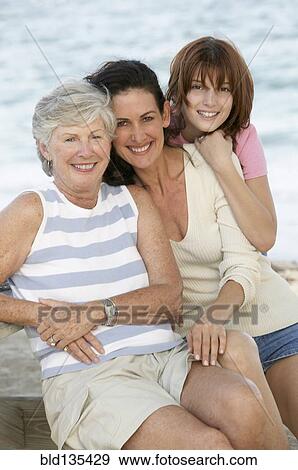Three generations of women smiling outdoors View Large Photo Image Stock Photo - Three generations of women smiling outdoors. Fotosearch