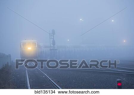 Train light in foggy station View Large Photo Image Picture - Train light in foggy station. Fotosearch