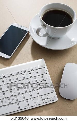 Wireless keyboard, mouse and cell phone on table View Large Photo Image Stock Photograph - Wireless keyboard, mouse and cell phone on table. Fotosearch