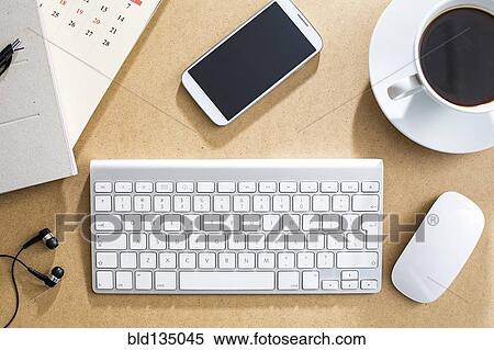 Wireless keyboard, mouse and cell phone on table View Large Photo Image Stock Photography - Wireless keyboard, mouse and cell phone on table. Fotosearch