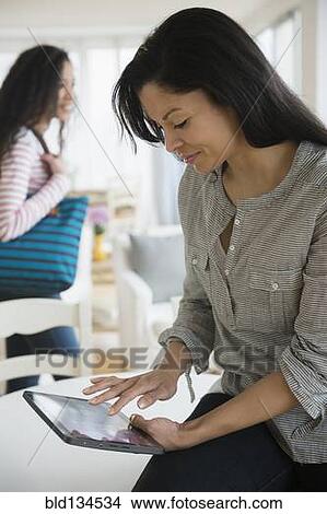 Woman using tablet computer View Large Photo Image Picture - Woman using tablet computer. Fotosearch