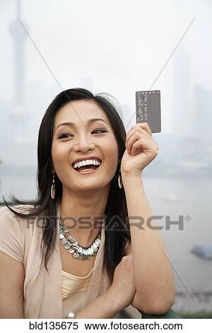 Woman with credit card, Shanghai, China View Large Photo Image Stock Photography - Woman with credit card, Shanghai, China. Fotosearch