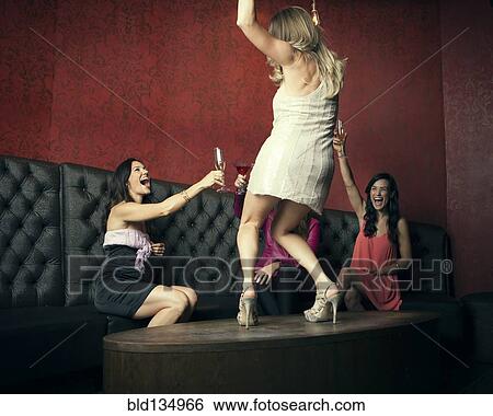 Women celebrating in nightclub View Large Photo Image Stock Photograph - Women celebrating in nightclub. Fotosearch