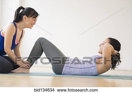 Picture - Women exercising together in gym. Fotosearch