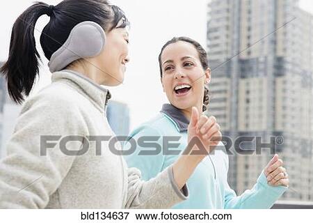 Women jogging together in city View Large Photo Image Stock Photo - Women jogging together in city. Fotosearch