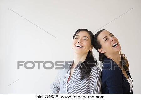 Women laughing together View Large Photo Image Stock Photo - Women laughing together. Fotosearch