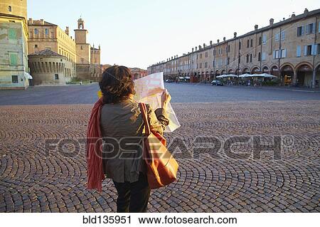 Women reading map in town square, Carpi, Emilia, Italy View Large Photo Image Stock Image - Women reading map in town square, Carpi, Emilia, Italy. Fotosearch