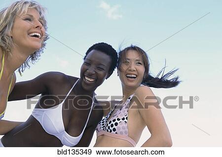 Women smiling together outdoors View Large Photo Image Stock Photo - Women smiling together outdoors. Fotosearch