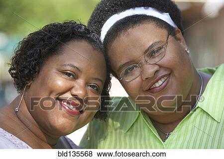 Women smiling together outdoors View Large Photo Image Stock Photo - Women smiling together outdoors. Fotosearch