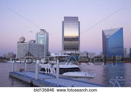 Yacht docked in urban bay, Dubai, United Arab Emirates View Large Photo Image Stock Photograph - Yacht docked in urban bay, Dubai, United Arab Emirates. Fotosearch
