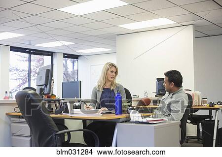 Picture - Business people talking in office. Fotosearch
