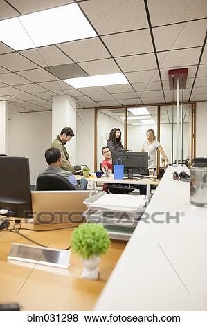 Business people talking in office View Large Photo Image Stock Photo - Business people talking in office. Fotosearch