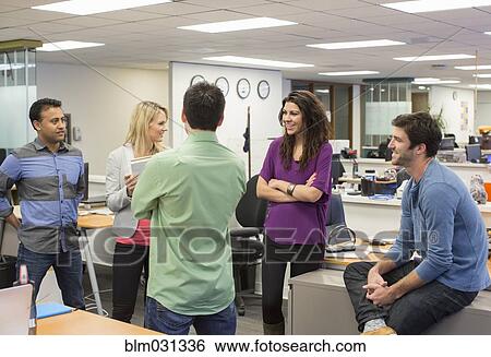 Stock Photograph - Business people talking in office. Fotosearch