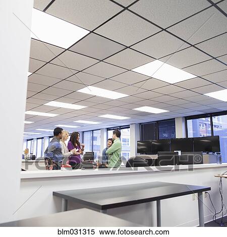 Stock Photography - Business people talking in office. Fotosearch
