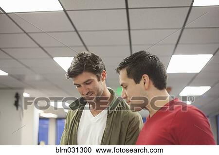 Businessmen talking in office View Large Photo Image Stock Image - Businessmen talking in office. Fotosearch