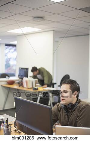 Businessmen working in office View Large Photo Image Stock Photograph - Businessmen working in office. Fotosearch