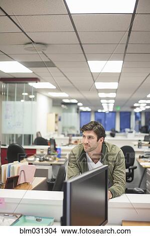 Picture - Caucasian businessman smiling in office. Fotosearch