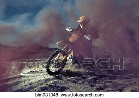Caucasian man riding dirt bike in dust cloud View Large Photo Image Stock Photo - Caucasian man riding dirt bike in dust cloud. Fotosearch