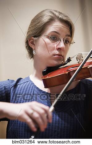 Picture - Close up of student playing violin. Fotosearch