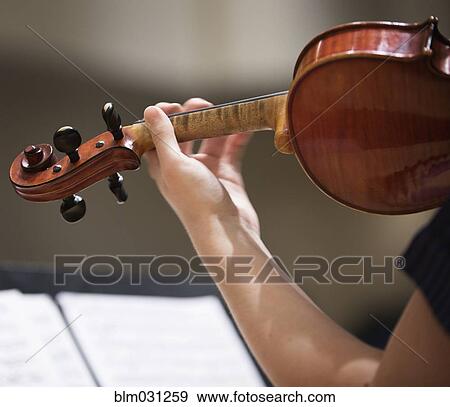 Close up of student playing violin View Large Photo Image Stock Photo - Close up of student playing violin. Fotosearch