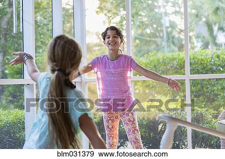 Girls playing together on porch View Large Photo Image Stock Photo - Girls playing together on porch. Fotosearch