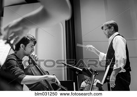 Professor conducting college orchestra View Large Photo Image Stock Image - Professor conducting college orchestra. Fotosearch