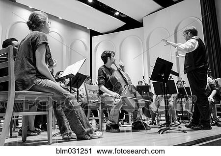 Professor conducting college orchestra View Large Photo Image Stock Image - Professor conducting college orchestra. Fotosearch