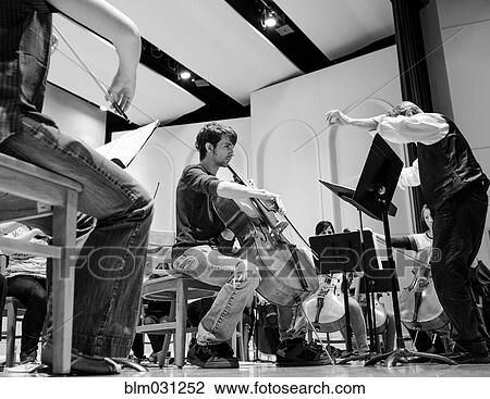 Professor conducting college orchestra View Large Photo Image Stock Image - Professor conducting college orchestra. Fotosearch