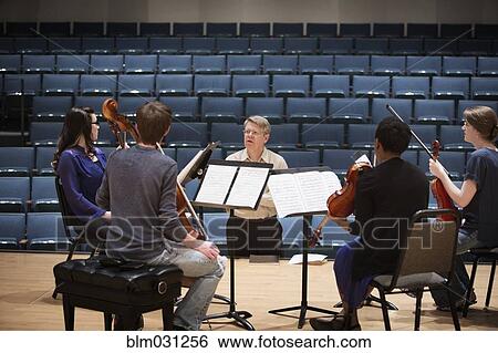 Professor instructing college string quartet View Large Photo Image Stock Photograph - Professor instructing college string quartet. Fotosearch