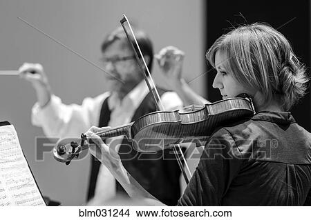 Student playing violin in college orchestra View Large Photo Image Picture - Student playing violin in college orchestra. Fotosearch