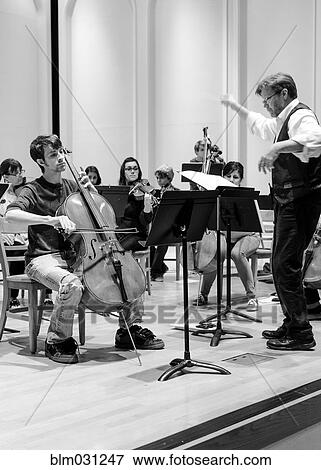 Stock Photo - Students playing in college orchestra. Fotosearch