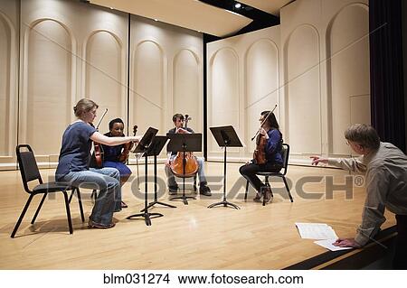 Picture - Students playing in college string quartet. Fotosearch
