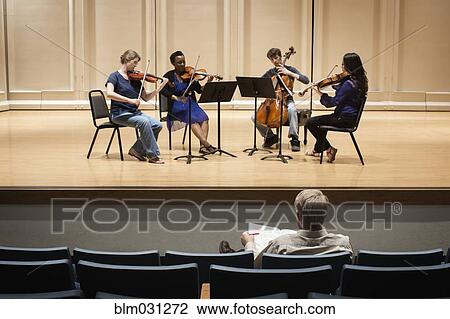 Stock Image - Students playing in college string quartet. Fotosearch