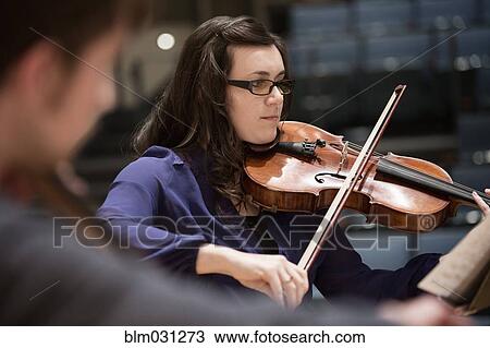 Stock Image - Students playing in college string quartet. Fotosearch