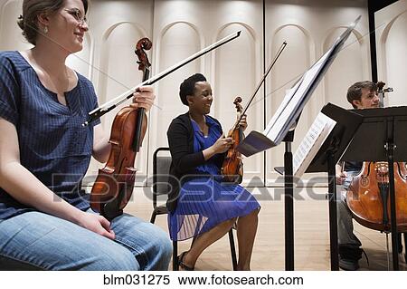 Stock Photography - Students playing in college string quartet. Fotosearch