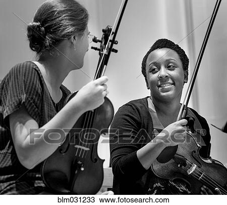 Students playing violin in college orchestra View Large Photo Image Stock Image - Students playing violin in college orchestra. Fotosearch