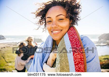 Woman wrapped in blanket on rural hillside View Large Photo Image Stock Photography - Woman wrapped in blanket on rural hillside. Fotosearch